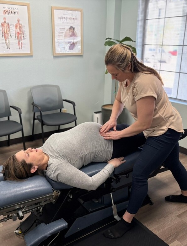 Reno chiropractor, Dr. Nelson adjusts a pregnant patient