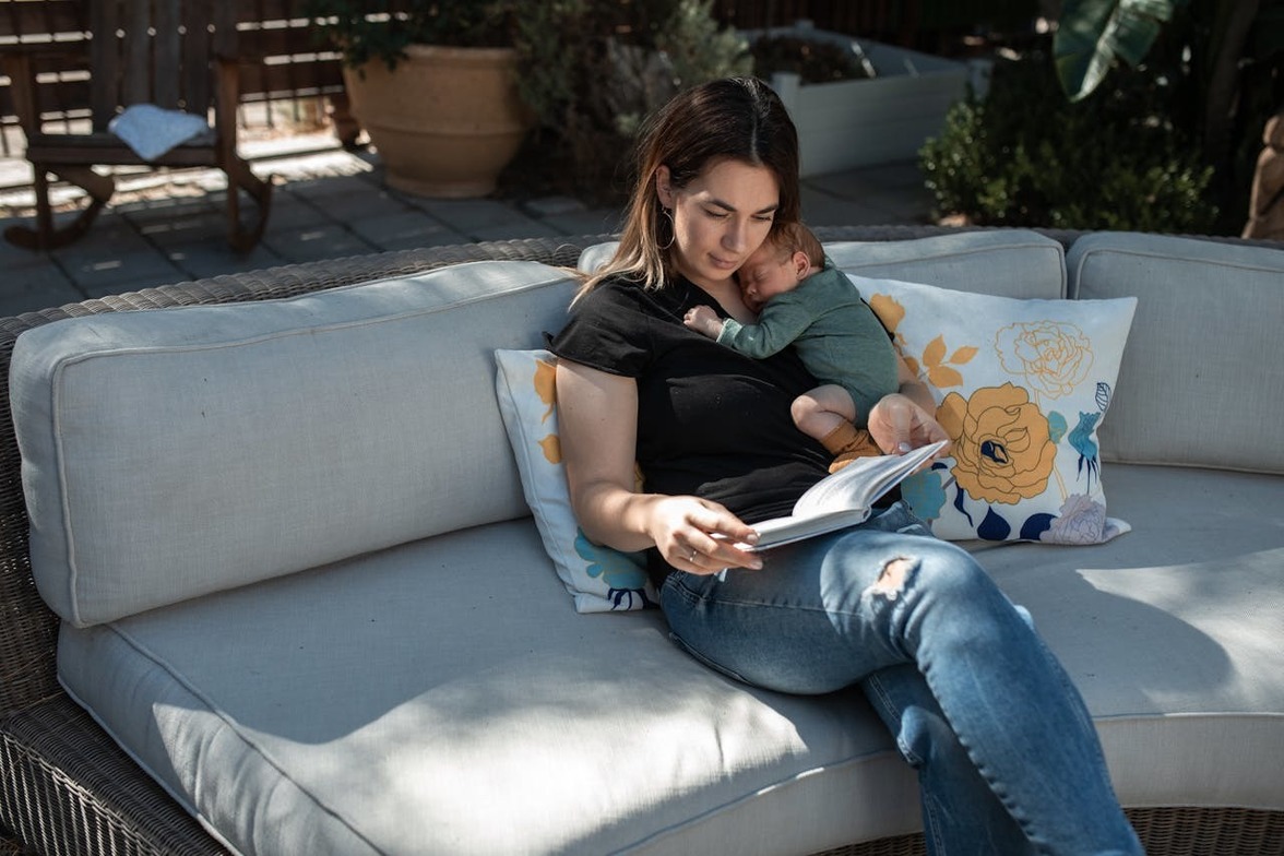 New mom reading with her baby